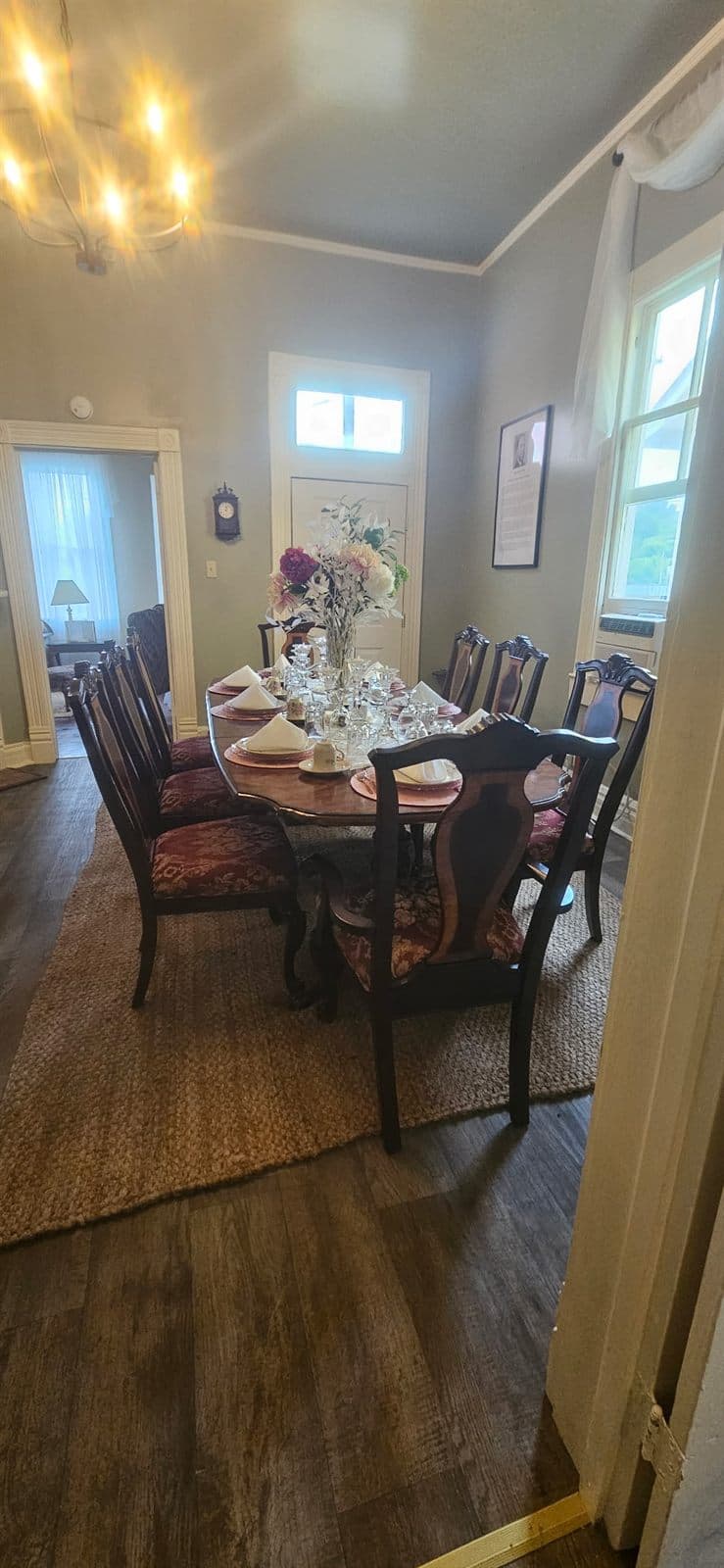 An intimate set table with floral arrangements awaiting guests.